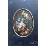 FOLLOWER OF NICOLA CASSISA (d.1730) AN URN OF MIXED FLOWERS ON A MARBLE LEDGE Oil on metal,