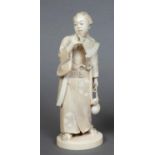 JAPANESE IVORY OKIMONO OF A BIJIN - SIGNED Meiji period, the figure wearing a floral okimono and a