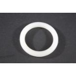 CHINESE JADE BANGLE a plain white jade bangle, 7.5cms diameter