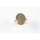 A GEORGE III GOLD AND BLACK ENAMEL MOURNING RING the centre section containing hair, with