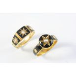 A VICTORIAN GOLD AND BLACK ENAMEL MOURNING RING centred with a small pearl in gold star motif within