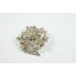 A VICTORIAN DIAMOND FOLIATE BROOCH millegrain set overall with graduated old-cut diamonds, the