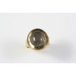A GEORGE III GOLD AND BLACK ENAMEL MOURNING RING the central section containing hair set within a