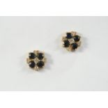 A PAIR OF SAPPHIRE AND DIAMOND STUD EARRINGS each earring set with four circular-cut sapphires and