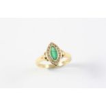 AN EMERALD AND DIAMOND MARQUISE-SHAPED RING the marquise-shaped emerald is set within a surround