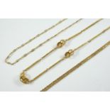 AN 18CT GOLD NECKLET formed with long engraved links and conjoining spherical links, 41cm long, 19.0