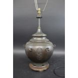 CHINESE LAMP a bronzed Chinese lamp, with panels of decoration including Dragon's, flowers and