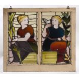 PAIR OF STAINED GLASS PANELS a pair of stain glass panels mounted in one frame, with depictions of