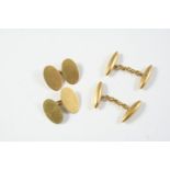 A PAIR OF 18CT GOLD CUFFLINKS of oval plain form, together with another pair of 18ct gold cufflinks,