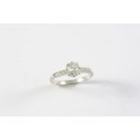 A DIAMOND SOLITAIRE RING the cushion-shaped diamond weighs approximately 0.80 carats and is set with