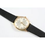 A GENTLEMAN'S GOLD AUTOMATIC WRISTWATCH BY GARRARD the signed circular dial with baton numerals