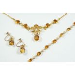 A CITRINE AND CULTURED PEARL NECKLACE mounted with circular-cut citrines and cultured pearls, in 9ct