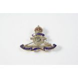 A DIAMOND AND ENAMEL REGIMENTAL BROOCH FOR THE ROYAL ARTILLERY mounted with rose-cut diamonds and