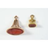 A 19TH CENTURY GOLD SEAL with foliate scrolling body, the carnelian matrix engraved with a hound,