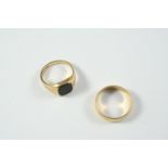 A BLACK ONYX AND 9CT GOLD SIGNET RING 5.3 grams, size O and an 18ct gold wedding band, 5.6 grams,