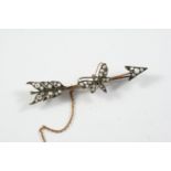 A VICTORIAN DIAMOND ARROW AND BUTTERFLY BROOCH mounted with rose-cut diamonds, set in silver and