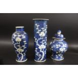 CHINESE BLUE & WHITE VASE a porcelain sleeve vase painted with prunus blossom, double circle mark to
