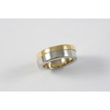 AN 18CT YELLOW GOLD AND STAINLESS STEEL RING BY GUCCI formed with two bands magnetically linked,