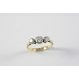 A DIAMOND THREE STONE RING the three graduated circular-cut diamonds are set in 18ct gold. Size M