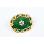 A VICTORIAN ENAMEL AND GOLD BROOCH the green guilloche enamel with gold foliate scrolling