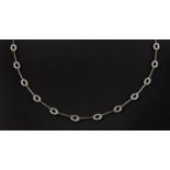 A DIAMOND AND GOLD NECKLACE the white gold necklace mounted with oval-shaped sections set with