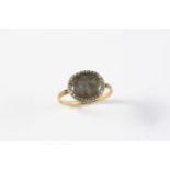 A GEORGE III DIAMOND AND GOLD MOURING RING the centre section containing hair is set within a