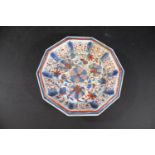 18THC CHINESE IMARI DISH a decagonal shaped dish with fluted sides, painted in imari colours with