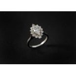 A DIAMOND MARQUISE-SHAPED CLUSTER RING the marquise-shaped diamond weighs approximately 1.10