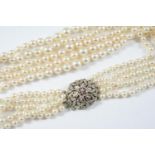 A FOUR ROW GRADUATED CULTURED PEARL CHOKER the pearls graduate from approximately 4.1mm tp 8.1mm and