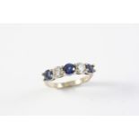 A SAPPHIRE AND DIAMOND FIVE STONE RING the three circular-cut sapphires are set with two brilliant-