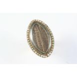 A GEORGE III GOLD AND PEARL SET MOURNING RING the navette-shaped centre section containing hair, set