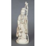 JAPANESE IVORY OKIMONO OF AN IMMORTAL - SIGNED Meiji period, the figure wearing flowing robes and