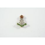 A DIAMOND AND ENAMEL REGIMENTAL BROOCH FOR THE GREEN HOWARDS mounted with single-cut diamonds and