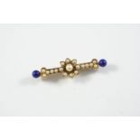 A LAPIS LAZULI AND PEARL SET FOLIATE BROOCH centred with an untested pearl and set overall with half