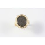 A VICTORIAN GOLD AND ENAMEL MOURNING RING the centre section containing hair set within a white