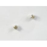 A PAIR OF DIAMOND STUD EARRINGS set with circular-cut diamonds weighing approximately 0.65 carats in