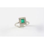 AN EMERALD AND DIAMOND CLUSTER RING the square-shaped emerald is set within a surround of circular-