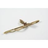 A PEARL AND GARNET DRAGONFLY BROOCH mounted with a circular garnet and small pearls, in gold, 6cm