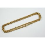 A GOLD CHAIN NECKLACE formed with circular links to a bolt ring clasp, 73cm long, 28.3 grams