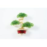 A CARVED NEPHRITE JADE, ENAMEL AND DIAMOND BROOCH formed as a bonsai tree, with red enamel and