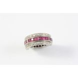 A RUBY, SAPPHIRE AND DIAMOND SWIVEL ETERNITY RING millegrain set with circular-cut diamonds and with