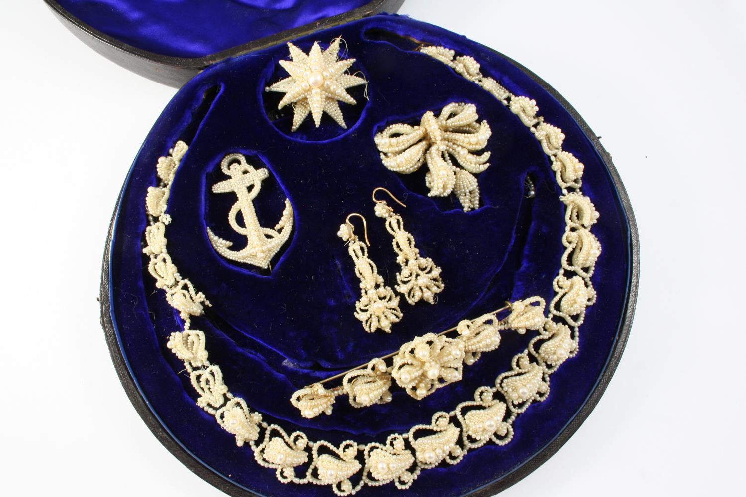 A VICTORIAN CASED SET OF SEED PEARL JEWELLERY comprising a necklace, a pair of drop earrings, an