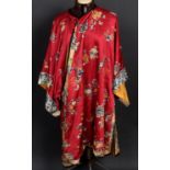 CHINESE SILK ROBE of red silk, decorated with silk and couched metallic thread embroidered images,