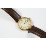 A LADY'S SILVER GILT WRISTWATCH BY MUST DE CARTIER the signed circular dial with Roman quarters,