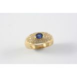 A SAPPHIRE AND DIAMOND RING the oval-shaped sapphire is set within a surround of circular-cut