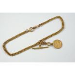 A 9CT GOLD CURB LINK WATCH CHAIN each link stamped 9 375, suspending a 9ct gold 't' bar and a gold