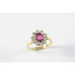 A PINK SAPPHIRE AND DIAMOND CLUSTER RING the oval-shaped pink sapphire is set within a surround of