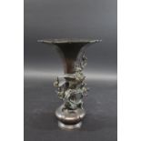 JAPANESE BRONZE VASE - SIGNED the vase with a fluted rim and tapering neck, with a bird of prey on a