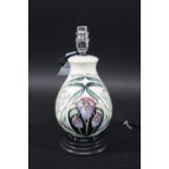 MOORCROFT LAMP in the Sorrow & Laughter design, mounted on a wooden base. With a Moorcroft shade.