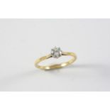 A DIAMOND SOLITAIRE RING set with a brilliant-cut diamond in 18ct gold and platinum. Size S